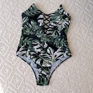 Tropical palm leaf print one-piece women’s swimsuit, size Large.
